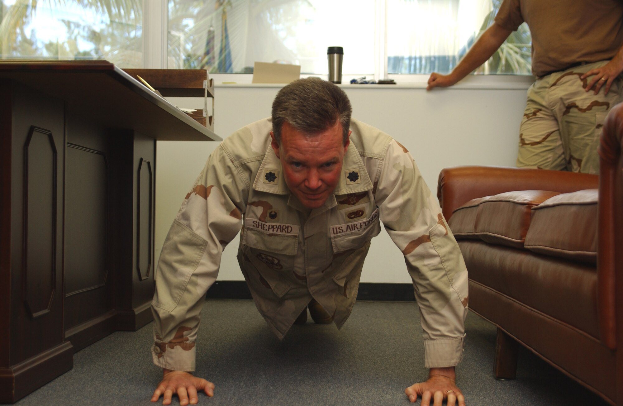SOUTHWEST ASIA -- Lt. Col. Jeff Sheppard knocks out one of more than 16,000 push-ups he has done during his rotation here at a forward-deployed location. He is shooting for 17,000. He is the former 28th Expeditionary Air Refueling Squadron commander. (U.S. Air Force photo)