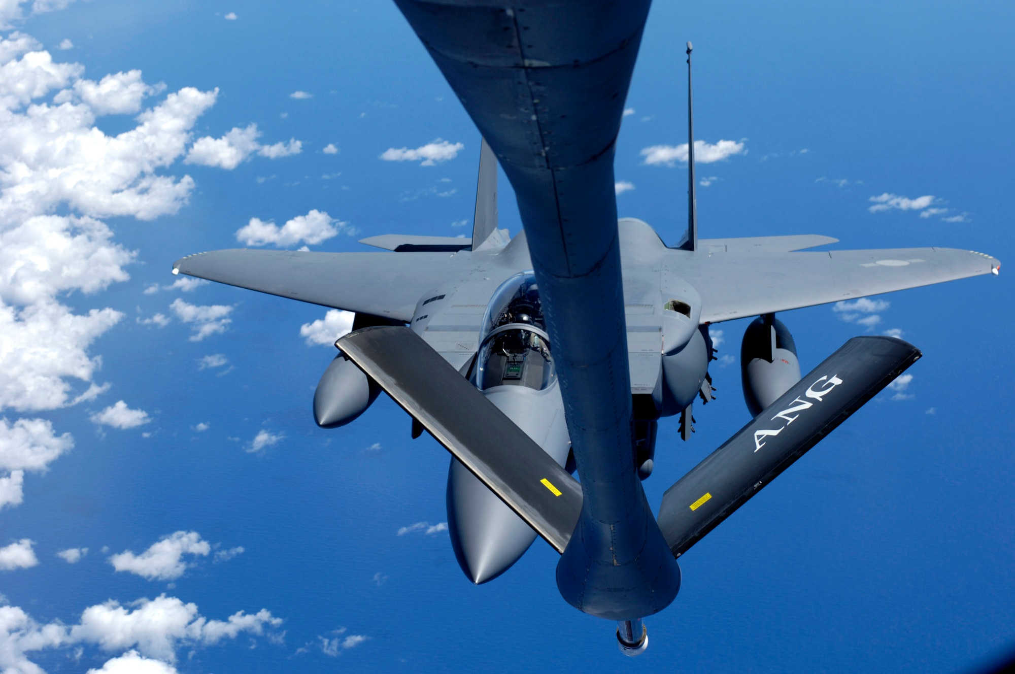 OVER THE PACIFIC -- A South Korean F-15K Eagle comes in for fuel from a KC-135 Stratotanker Oct. 4. The next generation F-15s are on their way to South Korea to make their debut at the Seoul Air Show. The South Korea Air Force purchased 40 fighters from Boeing for $4.2 billon. The Stratotanker is from the Hawaii Air National Guard's 203rd Air Refueling Squadron.  (U.S. Air Force photo by Tech. Sgt. Shane A. Cuomo) 