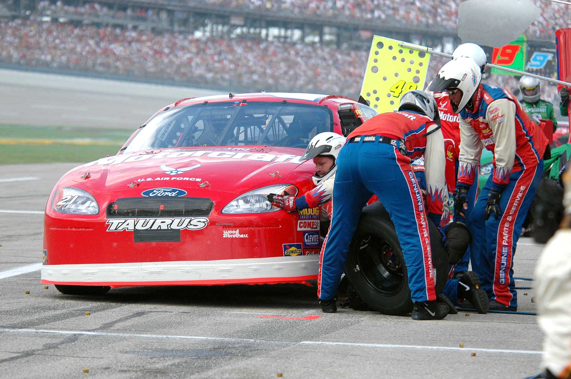 TALLADEGA, Ala. -- The Wood Brothers Racing Team conduct a 10-second pit stop on the No. 21 Air Force-sponsored NASCAR.  The car was recently driven by Ricky Rudd at Talladega Superspeedway on Oct. 2.  Four firefighters from Eglin Air Force Base, Fla., are among a group of firefighters from all over the country who travel each spring and fall to keep NASCAR drivers and race teams safe.  (U.S. Air Force photo by Senior Airman Mike Meares)