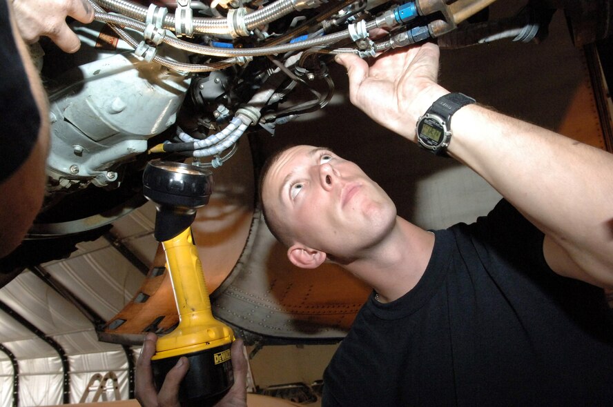 BAGRAM AIR BASE, Afghanistan -- Senior Airman Shaun Rancourt assists with replacing engine gaskets during a recent A-10 Thunderbolt II phase inspection here. In September, A-10s here flew 380 direct close-air support sorties supporting Operation Enduring Freedom. Airman Rancourt is a crew chief with the 455th Expeditionary Aircraft Maintenance Squadron and is deployed from Davis-Monthan Air Force Base, Ariz. (U.S. Air Force photo by Capt. James H. Cunningham)