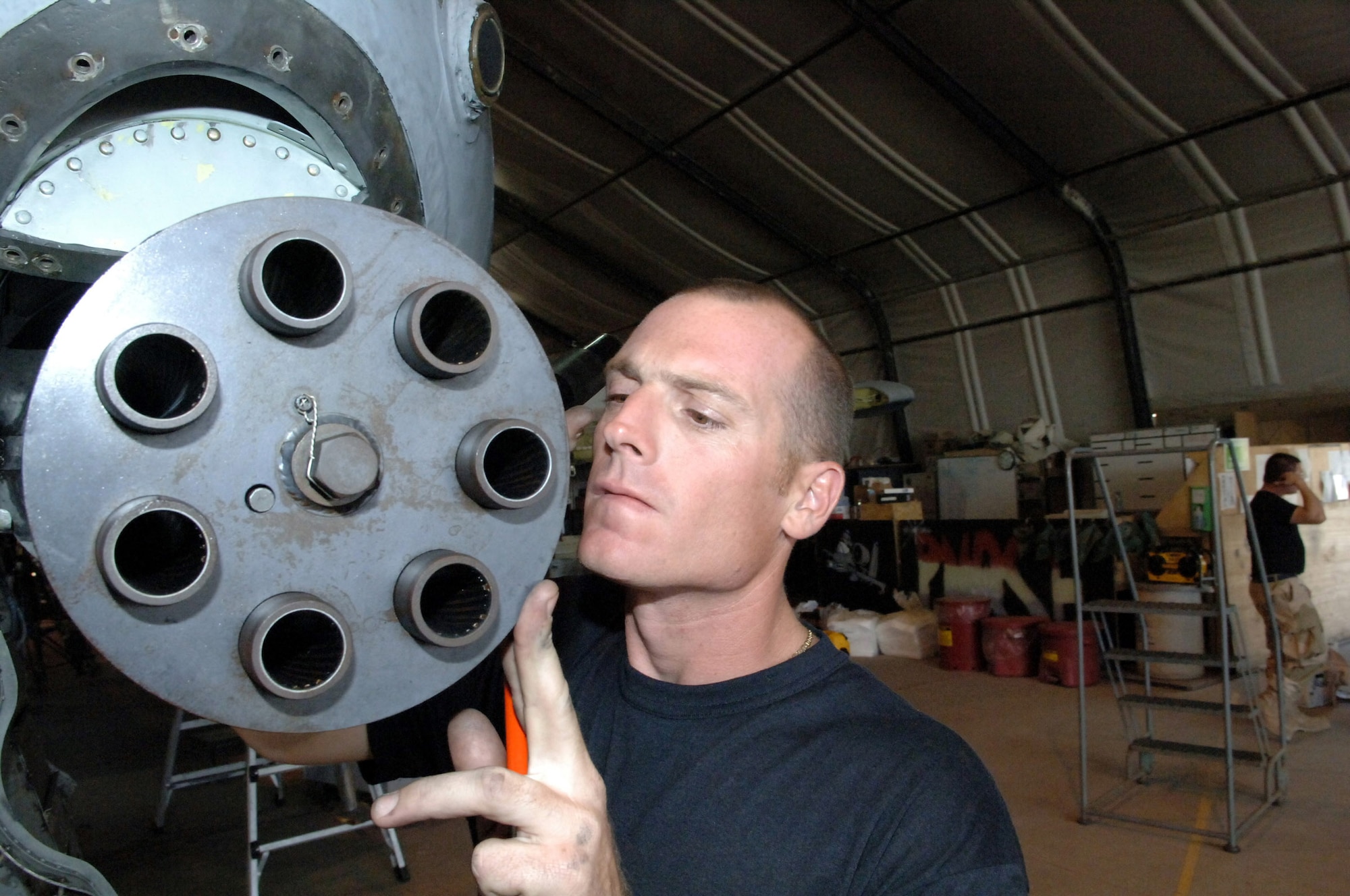BAGRAM AIR BASE, Afghanistan -- Tech. Sgt. Khristian Kirchhofer inspects a Gatlin gun during a recent phase inspection here.  A-10 Thunderbolt IIs are inspected every 400 flying hours. Sergeant Kirchhofer is an armament specialist with the 455th Expeditionary Aircraft Maintenance Squadron.  (U.S. Air Force photo by Capt. James H. Cunningham)
