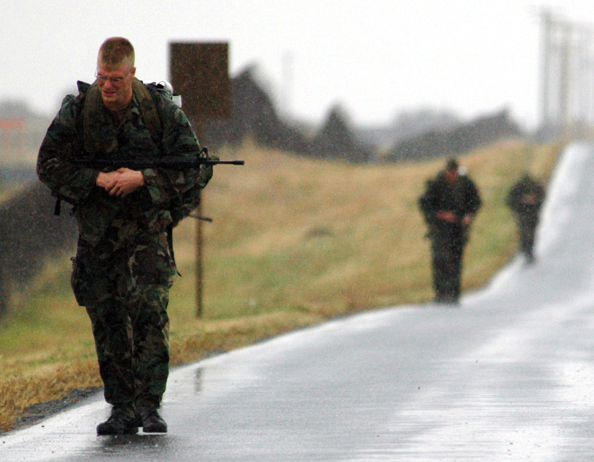 FAIRCHILD AIR FORCE BASE, Wash. -- Airmen with the 336th Training Group here haul 65-pound rucksacks on a 14-mile march as part of their Ranger School test.  Successful completion of this test will advance them as candidates to pre-Ranger School.  The march is only a portion of the 12-hour test they had to finish.  (U.S. Air Force photo by Staff. Sgt. Nathan Putz)