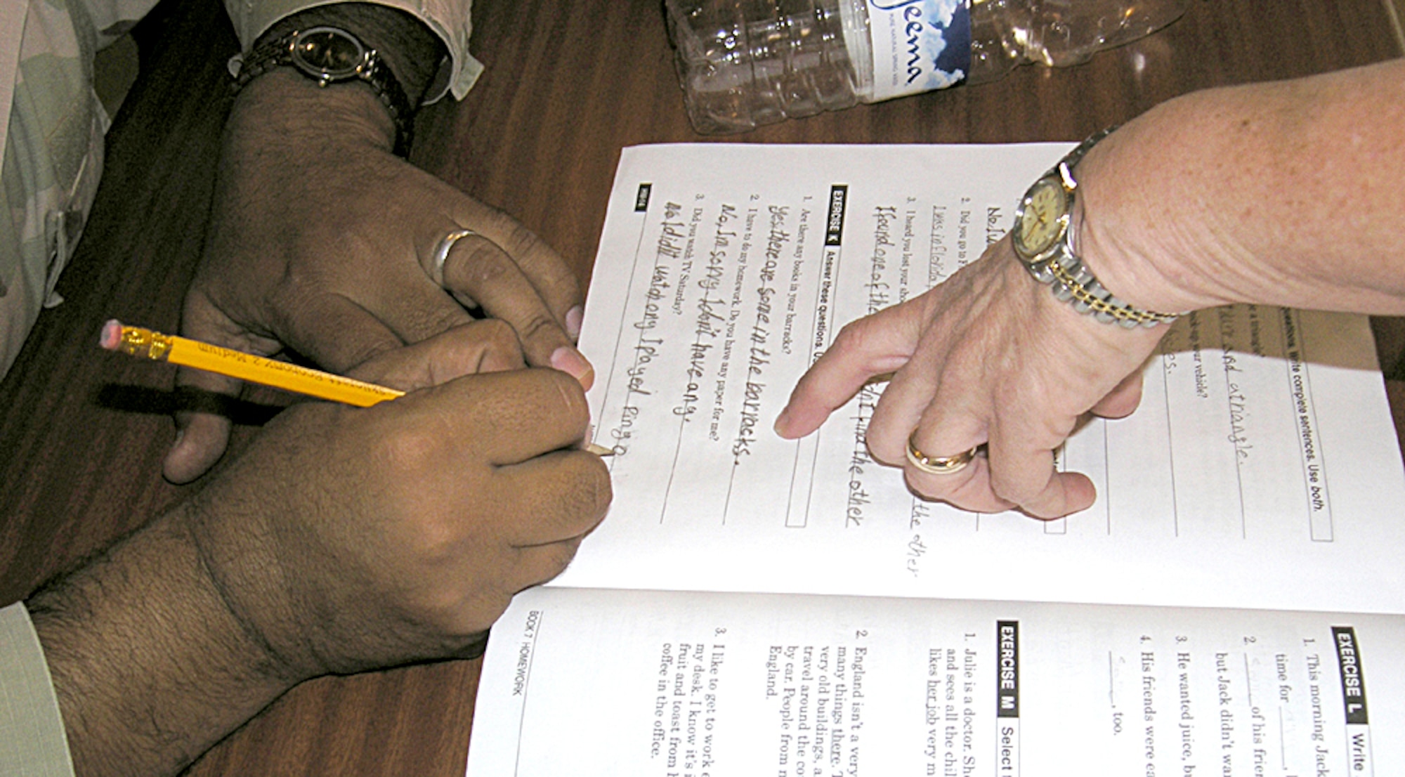 ALI BASE, Iraq -- Beverly Hall points to the lesson book of an Iraqi student during her English class.  There are 15 Iraqi students in her class.  Mrs. Hall is part of a four-person Defense Language Institute mobile training team here.  (U.S. Air Force photo by Tech. Sgt. Paul Dean)   