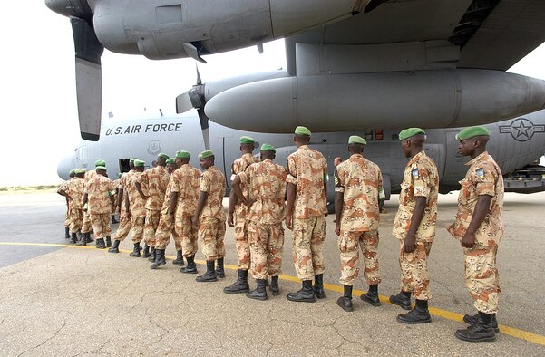 SUDAN -- Rwandan peacekeepers prepare to board a C-130 Hercules from Ramstein Air Base, Germany, on Oct. 4.  The peacekeepers are departing the Darfur region of Sudan and returning to Rwanda after a six-month deployment supporting the African Union Missions.  (U.S. Air Force photo by Master Sgt. David D. Underwood Jr.)