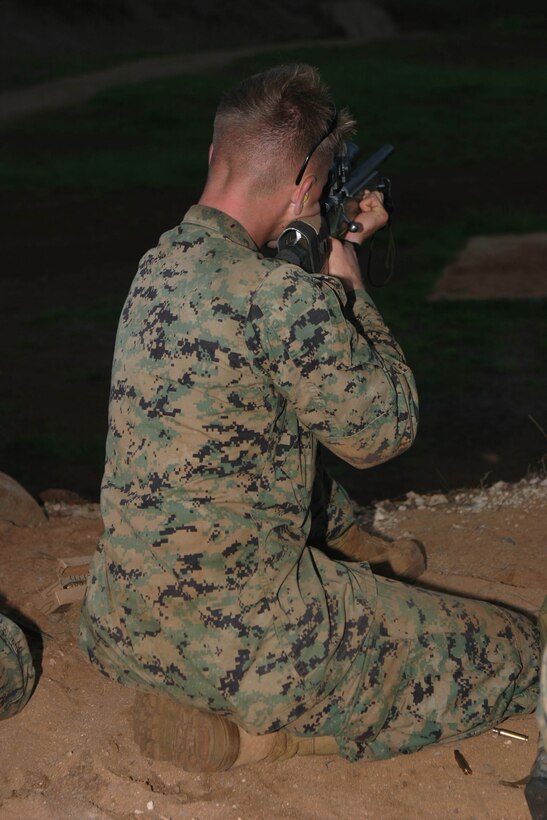 A scout sniper student finds comfort and steadiness in a semi-kneeling position during the Scout Sniper Basic Course Friday at Schofield Barracks during position shooting training, It is one of many positions a Marine may use while in a combat situation.