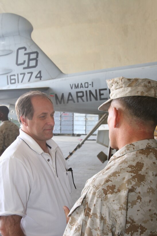 Massachusetts Rep. Michael Capuano, one of six U.S. House of Representative members in a congressional delegation, talks with 2nd Marine Aircraft Wing (Forward) commanding general, Brig. Gen. Robert E. Milstead, Oct. 10, at Al Asad, Iraq. The delegation visited Al Asad for a firsthand view of the Marine Corps? Aviation Combat Element, and to spend time with the service members behind the scenes of security and stabilization operations.