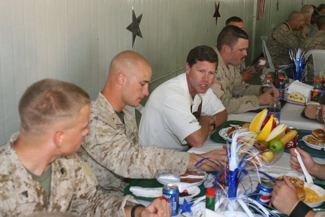 Ron Kind, Wisconsin?s 3rd Congressional District representative, talks with Marines from Wisconsin during a congressional delegation visit, Oct. 10, at Al Asad, Iraq. Kind, on his third trip to Iraq, spent time with service members talking about their hometowns, their jobs and their experiences during the deployment.