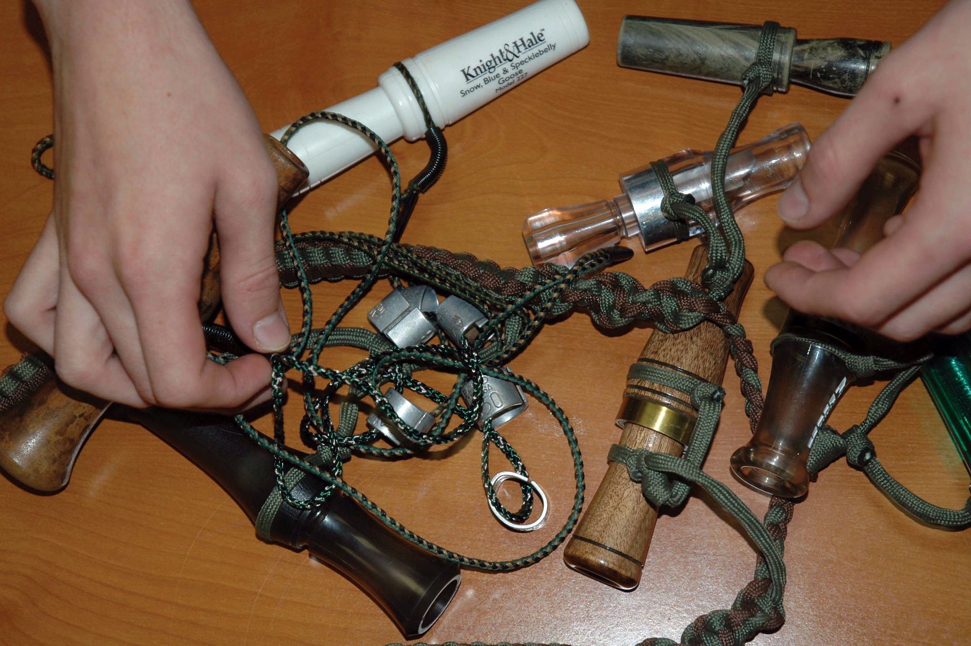 MINOT AIR FORCE BASE, N.D. -- Airman 1st Class Dustin Easton has numerous devices for calling birds.  He started bird calling when he was 10 years old while hunting with his grandfather.  He is a champion bird caller and has competed in bird calling competitions nationwide.  He is assigned to the 5th Civil Engineer Squadron here.  (U.S. Air Force photo by Senior Airman Danny Monahan)