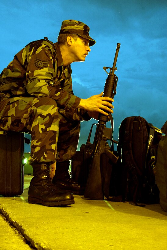 ANDERSEN AIR FORCE BASE, Guam -- Staff Sgt. Israel Soto waits to process for deployment during Exercise Beverly Palm 05-07.  The routine exercise is held several times a year to sharpen the mobility and wartime capabilities of participating servicemembers.  Sergeant Soto is assigned to Detachment 1, 613th Contigency Response Group.  (U.S. Air Force photo by Airman 1st Class Miranda Moorer)