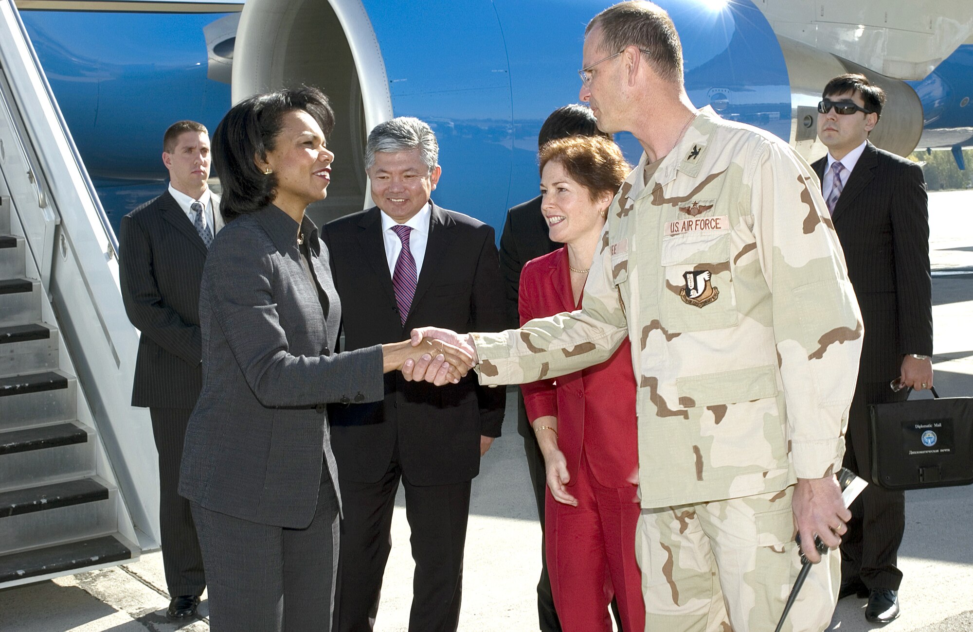 MANAS AIR BASE, Kyrgyzstan -- Col. Randy Kee greets U.S. Secretary of State Condoleezza Rice as she steps off the plane here Oct. 11. Colonel Kee is the 376th Air Expeditionary Wing commander. (U.S. Air Force photo by Robin Hicks)