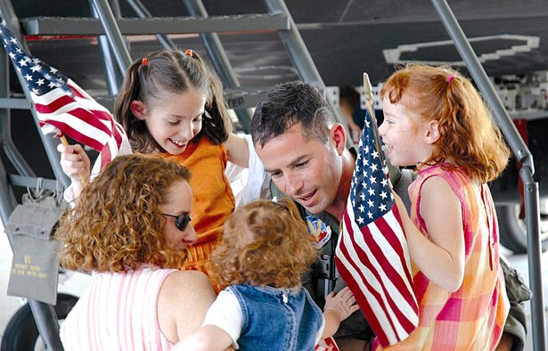 HOLLOMAN AIR FORCE BASE, N.M. -- Maj. Brian Collins, greets his family Oct. 10 after returning from Kunsan Air Base, South Korea. The 8th Fighter Squadron's Airmen and more than 250 Airmen here have been deployed since May supporting of the United States' national defense objectives in the Western Pacific Region. (U.S. Air Force photo by Tech. Sgt. James Hunt) 