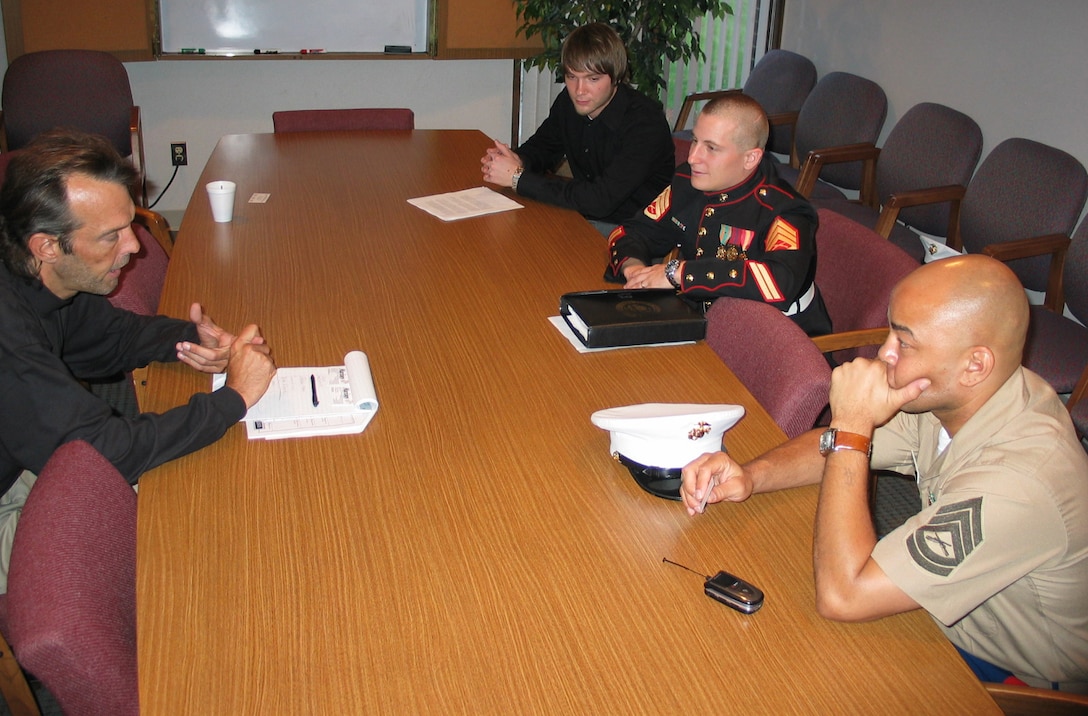 Staff Sgt. Jason M. Duggar and Gunnery Sgt. Terry Love of RSS Flint discuss community relations with local radio station.  Working on all recruiting aspects helped lead RS Lansing to score the top spot among 9th Marine Corps District recruiting stations.