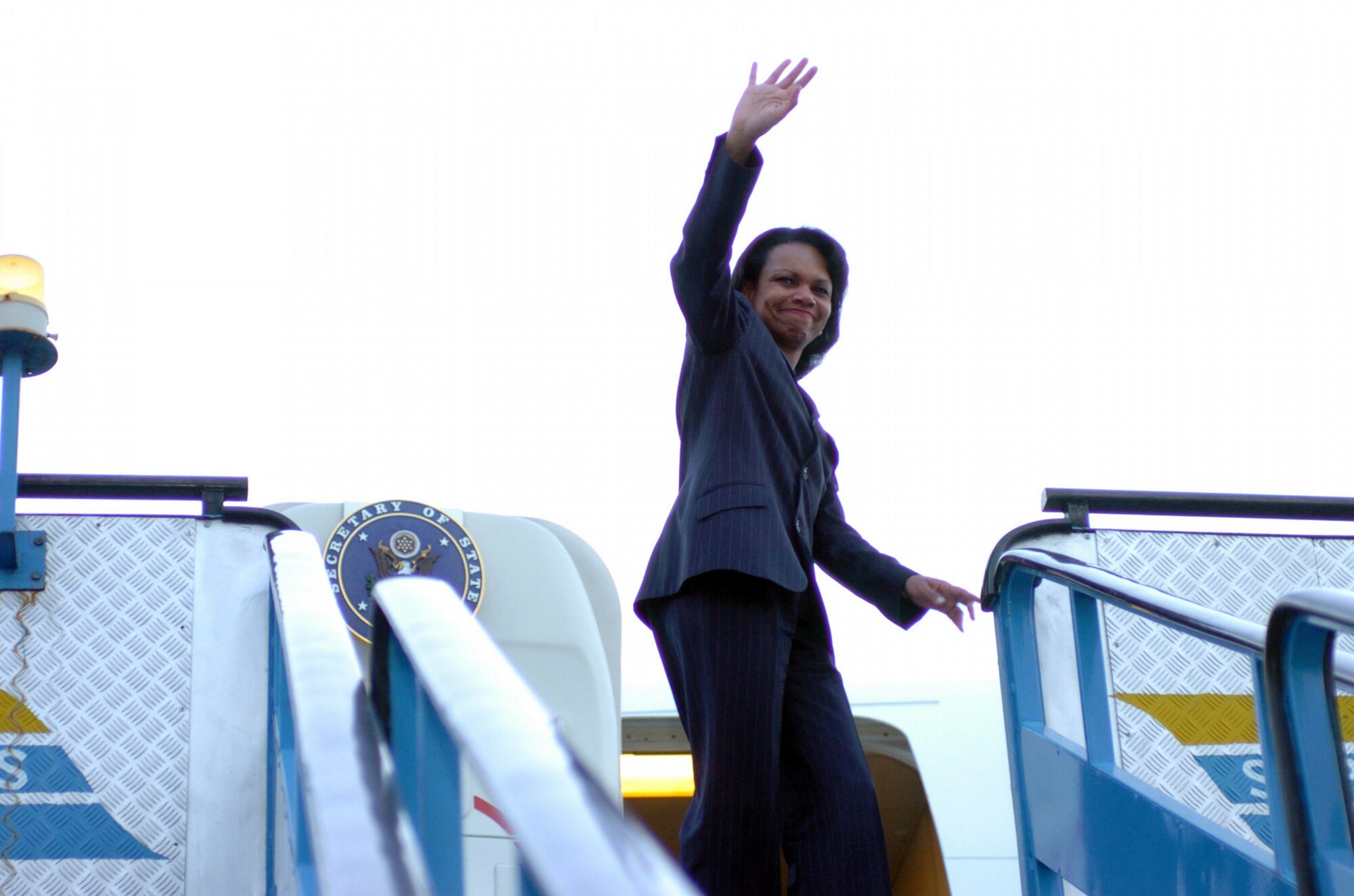 CHAKLALA, Pakistan -- U.S. Secretary of State Condaleeza Rice waves following a visit to the Pakistani air force base here Oct. 12. The Department of Defense is participating in the multinational effort to provide humanitarian assistance and support to Pakistan and parts of India and Afghanistan following a devastating earthquake. (U.S. Navy photo by Petty Officer 2nd Class Timothy Smith)