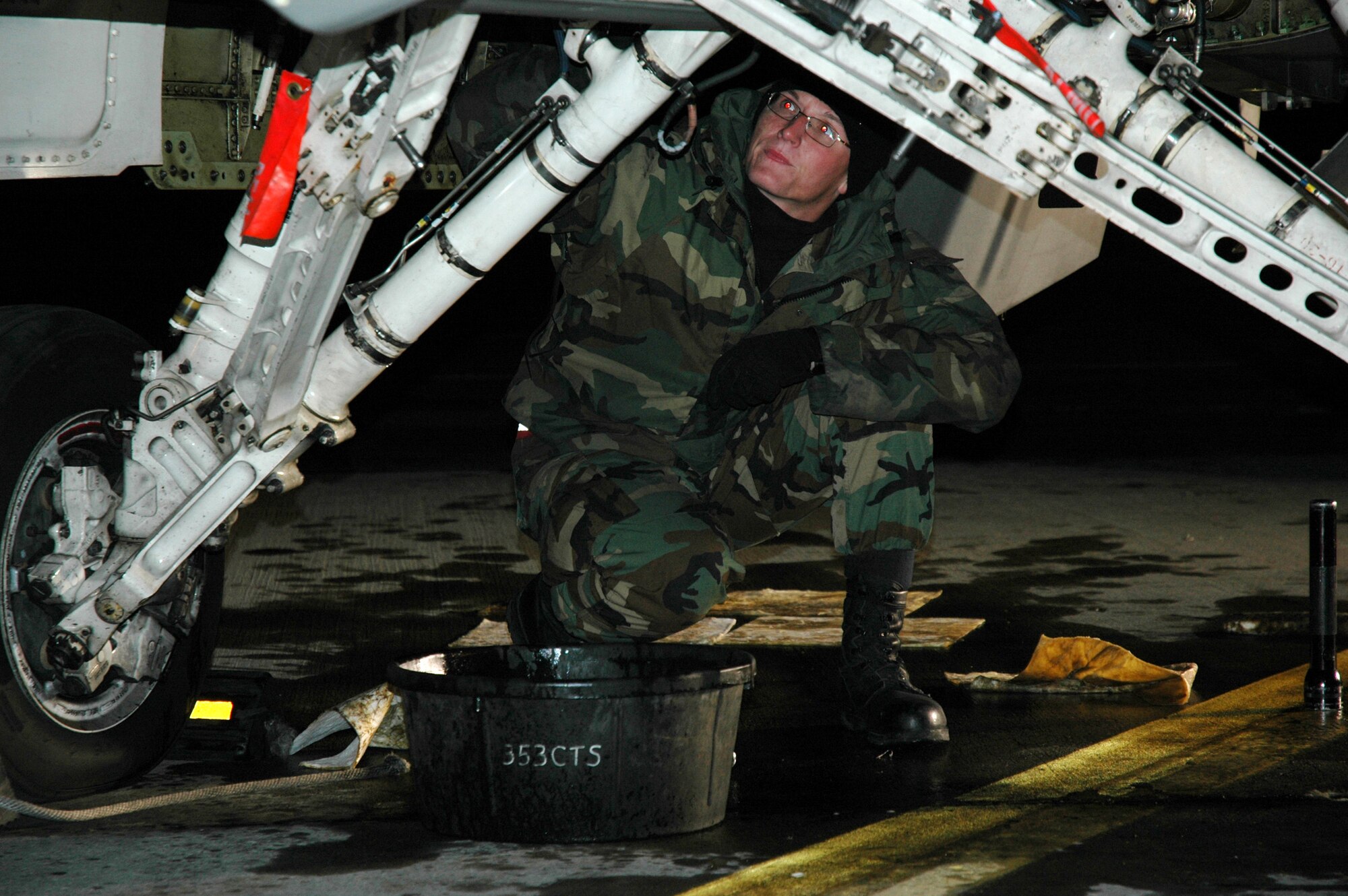 EIELSON AIR FORCE BASE, Alaska -- Senior Airman Deryck Griggs fixes an oil leak on his F-16 Fighting Falcon. The Airman, from the 52nd Aircraft Maintenance Squadron, Spangdahlem Air Base, Germany, is taking part in exercise Cope Thunder 06-1, which ends Oct. 21. Some 1,000 active duty and Air National Guard Airmen and 87 aircraft are taking part in the exercise. Pacific Air Forces hosts the two-week air combat training exercise. (U.S. Air Force photo by Airman 1st Class Justin Weaver)