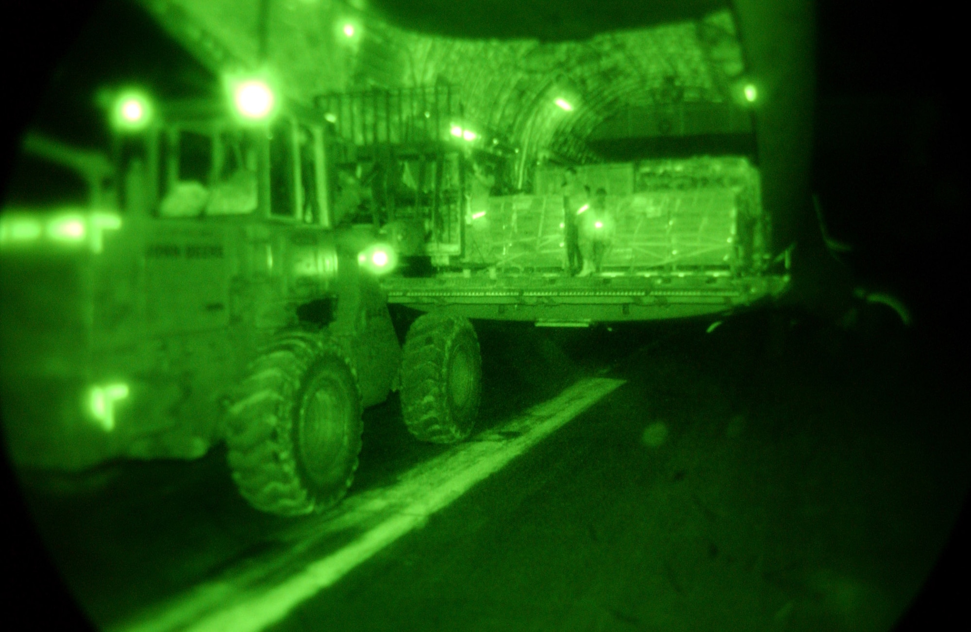 ISLAMABAD, Pakistan -- Airmen unload cargo in support of the Pakistan earthquake relief effort here Oct. 11. The Air Force is delivering disaster relief supplies and services as part of a multinational effort to provide aid and support to Pakistan and parts of India and Afghanistan following a devastating earthquake.  (U.S. Air Force photo by Airman 1st Class De-Juan Haley)