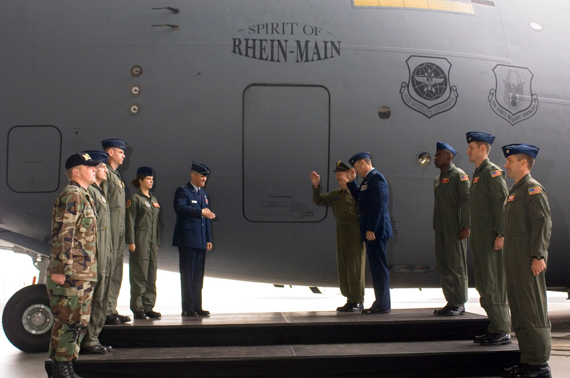 RHEIN-MAIN AIR BASE, Germany -- At the official closing ceremony of this base Oct. 10, (from left) Air Mobility Command vice commander Lt. Gen. Christopher A. Kelly, retired Lt. Col. Gail Halvorsen and Col. Bradley Denison, 469th Air Base Group commander, christen a C-17 Globemaster III the "Spirit of Rhein-Main." The aircraft is from McChord Air Force Base, Wash. Sixty years after operations started here, the Air Force will turn the base over to the Frankfurt Airport Authority. (U.S. Air Force photo by Master Sgt. John E. Lasky)