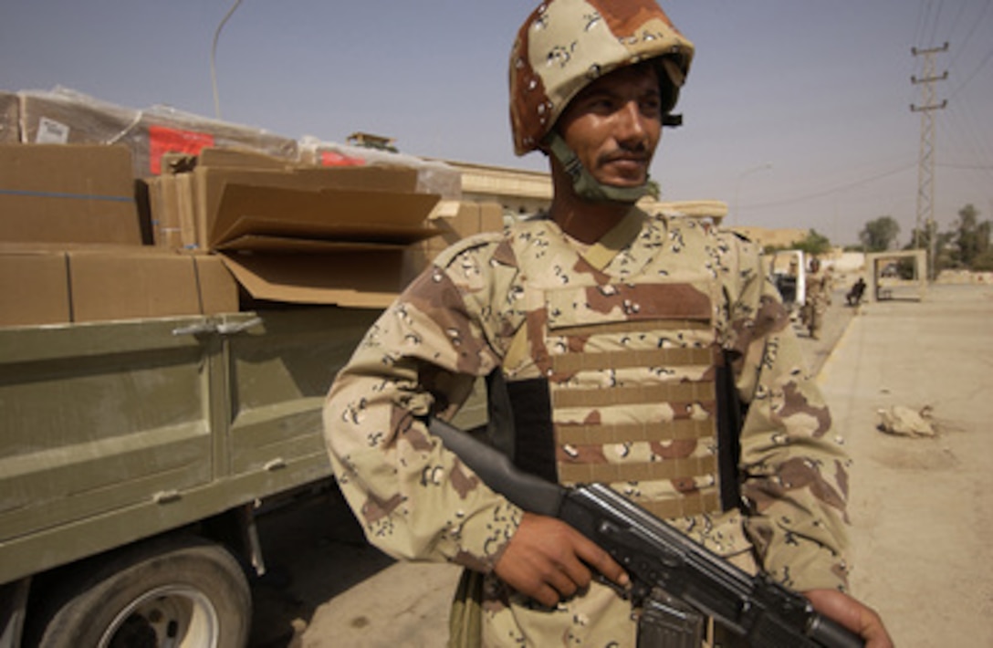 An Iraqi Army soldier guards a truck filled with ballot boxes in Samarra, Iraq, on Oct. 13, 2005. The boxes will be delivered to poll locations throughout Samarra for Saturday's nationwide constitutional referendum. 