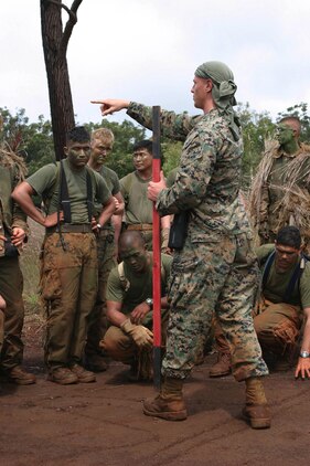 Sgt. Michael A. McClay, chief instructor, Scout Sniper Basic Course, gives the students a few words of advice before releasing them to start their 700-meter stalk Oct. 13, at Schofield Barracks' East Range Training Area.