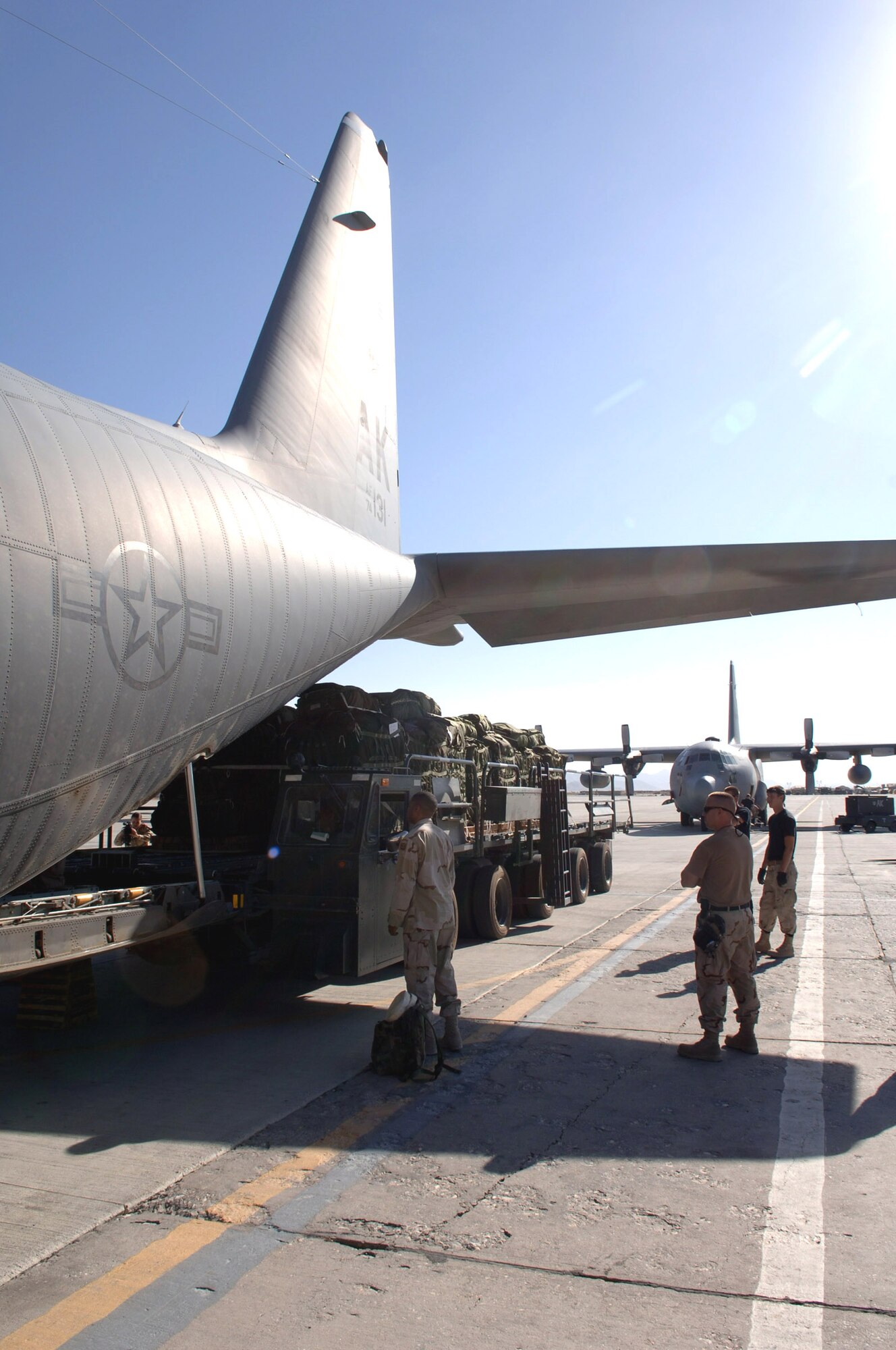 BAGRAM AIR BASE, Afghanistan - Airmen load a C-130 Hercules from the 517th Airlift Squadron with 14 pallets of relief supplies bound for Pakistan. The flight was the first air drop mission into the country, devastated by an Oct. 8 by a magnitude 7.6 earthquake. Soldiers and Airmen here assemble approximately 20,000 pounds of food, blankets, and supplies for the drop. To date, more than 180,000 pounds of food, water, cots and medical supplies have been flown out of Bagram headed for Pakistan. (U.S. Air Force photo by Capt. James H. Cunningham)