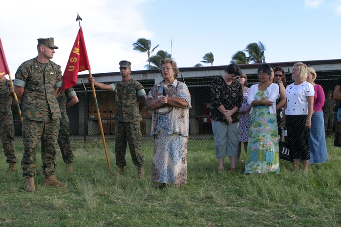 Navy/Marine Corps Relief Society Director Patricia Auntie Pat Perry (right) speaks after receiving a plaque of thanks from Lt. Col. Norm Cooling, commander, 3rd Battalion, 3rd Marine Regiment.