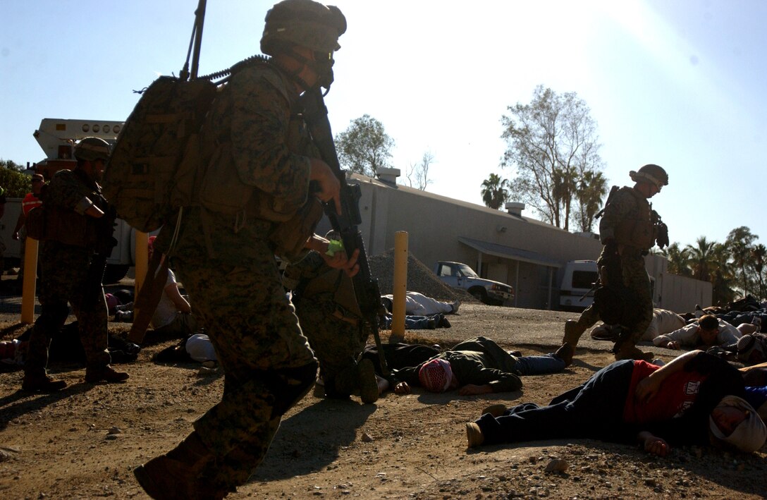 After a suicide bomber detonated an improvised explosive device, killing 24 unidentified people including himself, Marines from 1/4, Company A, 2nd platoon, search for survivors during the 11th MEU's TRUE exercise, Oct. 14. Official USMC photo by: Cpl Ruben D. Calderon (For public release)