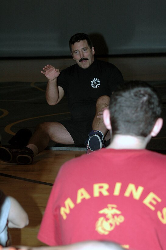 Professional wrestler and Ultimate Fighting Championship legend Dan Severn talks to poolees and Marines from RS Seattle Saturday at the Bally's Fitness Center in Puyallup, Wash. Severn was in the area to support the  X-Fighting Championship in the Tacoma Dome, in Tacoma, Wash.