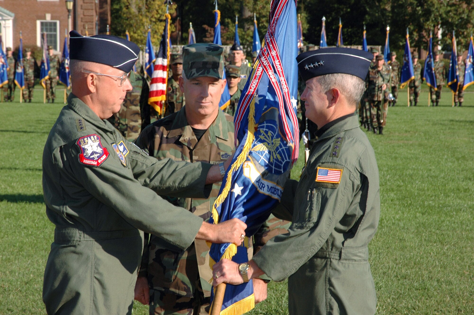 SCOTT AIR FORCE BASE, Ill. -- Gen. T. Michael Moseley, far left, Air Force Chief of Staff, transfers command of Air Mobility Command to Gen. Duncan McNabb. The assumption of command took place here Oct. 14.
