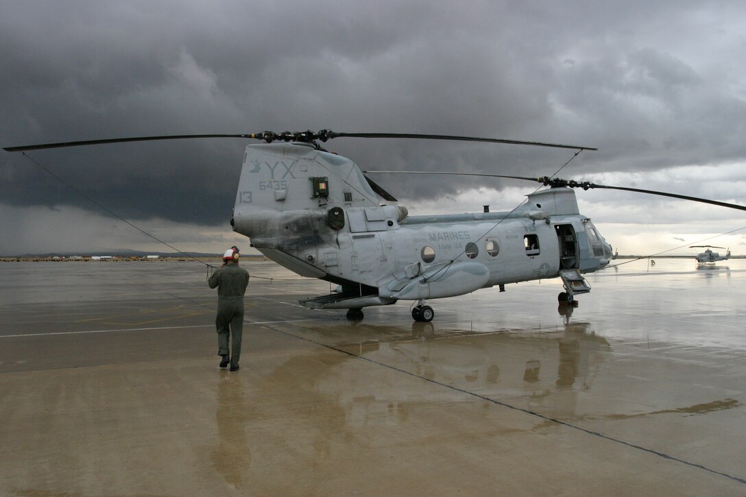 Cpl. Ivan Sahagun, a CH-46 Sea Knight crewchief, with the "Sea Elks" of the Marine Medium Helicopter Squadron 166 (Reinforced), 11th Marine Expeditionary Unit, prepares his aircraft for a night training  mission Oct. 17, 2005.  The 11th MEU is currently conducting Training in an Urban Environment (TRUE) from October 11-21 at various locations in the greater San Bernardino, Calif., area. TRUE is part of a routine, six-month training cycle for the 11th MEU in preparation for their upcoming deployment to the Western Pacific and Persian Gulf regions.