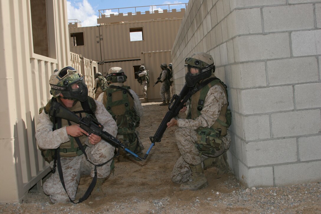 Sgt. Nicholas N. Lopez, 12th Marine Corps District, gets a breat of cool air while performs jumping jacks after a 20-minute cycling drill in a hot tent.