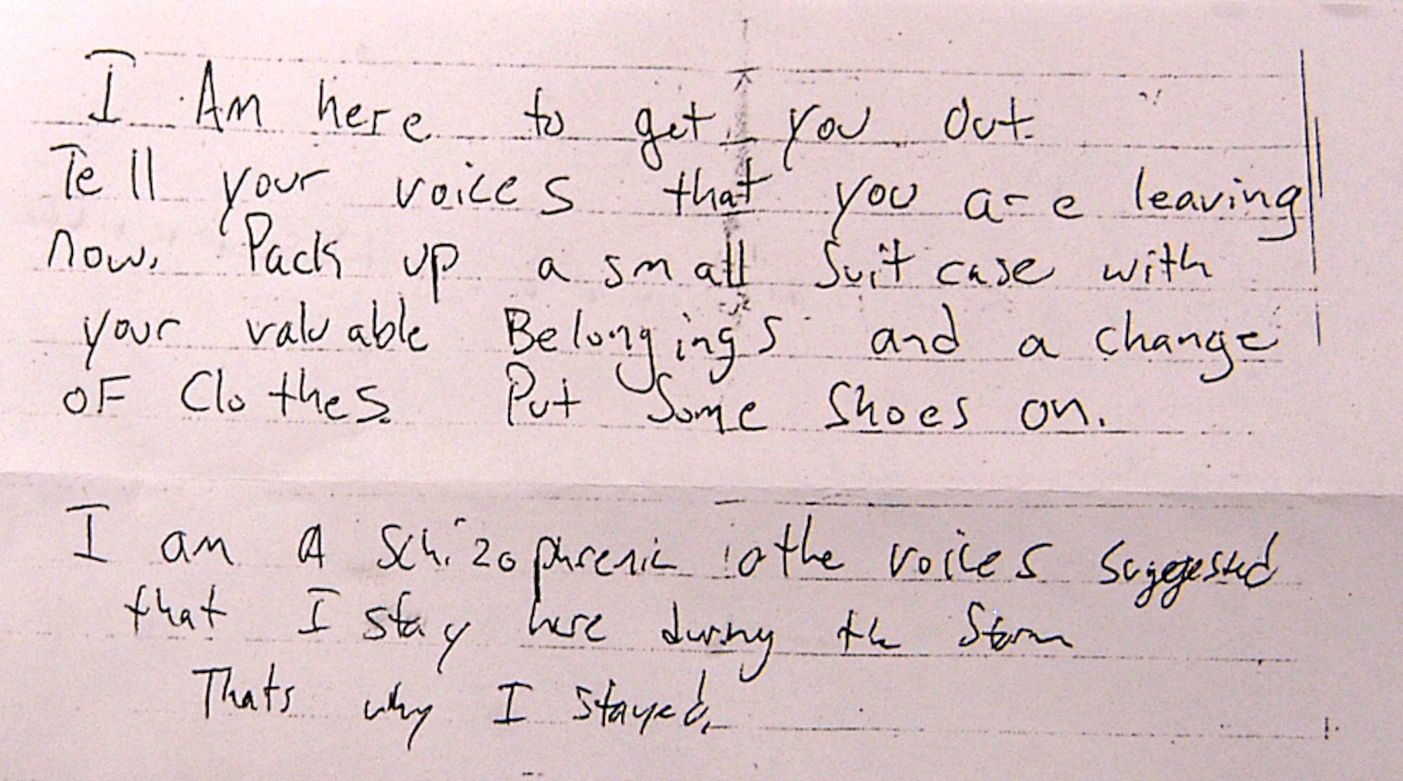 Tech. Sgt. Andrew Canfield, full-time Air Force reservist and pararescue jumper, communicates with one of his rescues, Joseph, by writing notes.  Joseph, who had spent 10 days in his flooded New Orleans home, is nonverbal and was found hovering over a small lit candle in his second-floor bedroom.  He motioned to the PJ for something to write on and they began a written dialogue that resulted in the PJ successfully extracting him.  Sergeant Canfield is with the 304th Rescue Squadron, Portland IAP, Ore.  (Air Force photo by Senior Master Sgt. Elaine Mayo)

 

