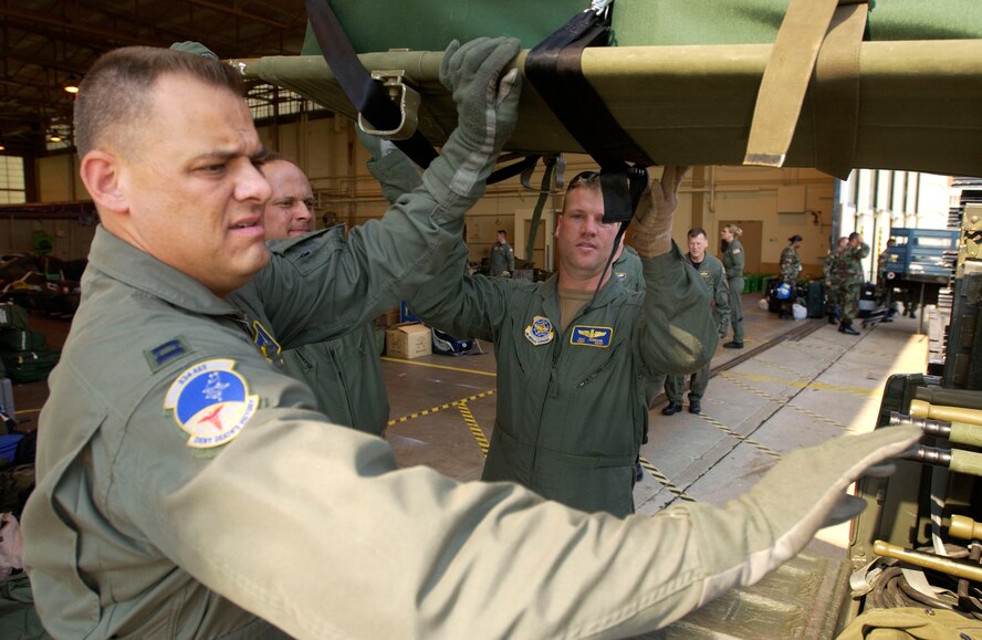 050905-F-7441T-2431  Members of the 934th Aeromedical Evacuation Squadron lift a litter into a truck before leaving Kelly Field, Texas, on a mission. The Airmen from the 934th made up an aeromedical evacuation team that flew from Texas to New Orleans, later dropping patients off at locations around the United States. (U.S. Air Force photo by Tech. Sgt. Jason Tudor)                               