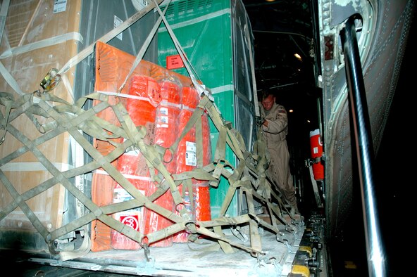 CHAKLALA, Pakistan -- Maj. James Bruner helps upload relief supplies. A C-130 Hercules loaded with more than 15,000 pounds of supplies flew the earthquake relief supplies here from Southwest Asia Oct. 15. The major is with the 745th Expeditionary Airlift Squadron. (U.S. Air Force photo by Senior Airman Cassandra Locke)