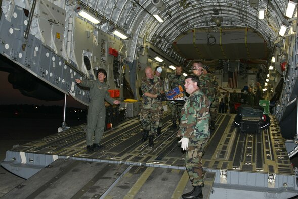 050901-F-3742P-003     Lt. Col. Martha (Marty) Soper from 22nd Air Force gives direction to volunteers offloading critically injured patients evacuated from New Orleans as a result of Hurricane Katrina. The patients were sent to Dobbins Air Reserve Base, Ga., Sept. 1 where they were stabilized and transported to Atlanta hospitals. (U.S. Air Force photo by Donald Peek)