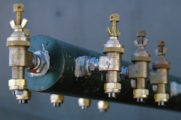 050719-F-2585R-001   The Modular Aerial Spray System on Air Force Reserve Command C-130 aircraft can use a setting called ultra-low-volume and specialized spray boom nozzles like these to spread one-half to an ounce of chemical over an acre. The droplets need only be large enough to attach to the hair on a mosquitos leg to be effective. (U.S. Air Force photo by Master Sgt. Bryan Ripple)