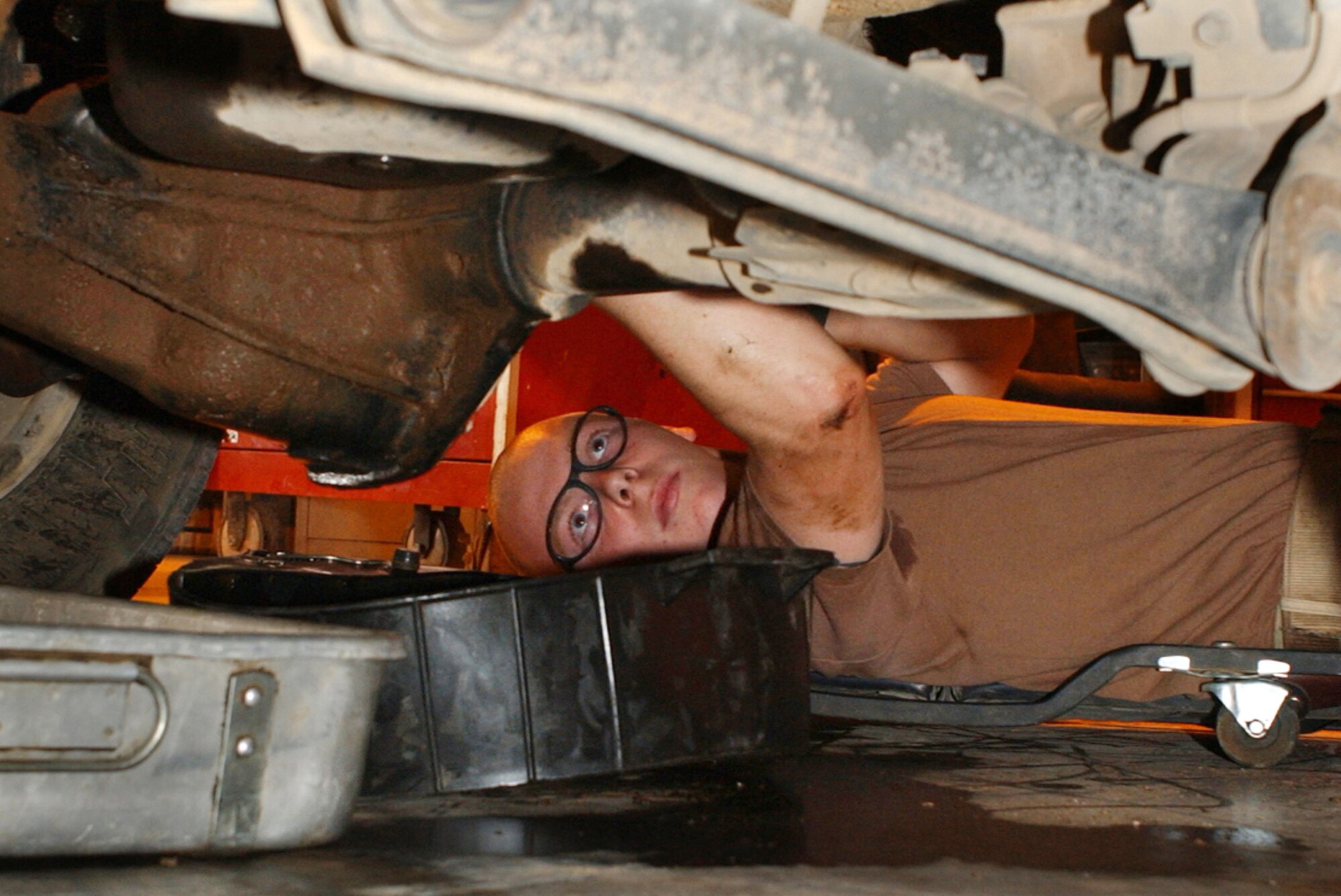 BALAD AIR BASE, Iraq -- Senior Airman Brad Mahoney, 332nd Expeditionary Logistics Readiness Squadron, changes an inner axle seal Tuesday. (U.S. Air Force photo by Senior Airman Bryan Franks)