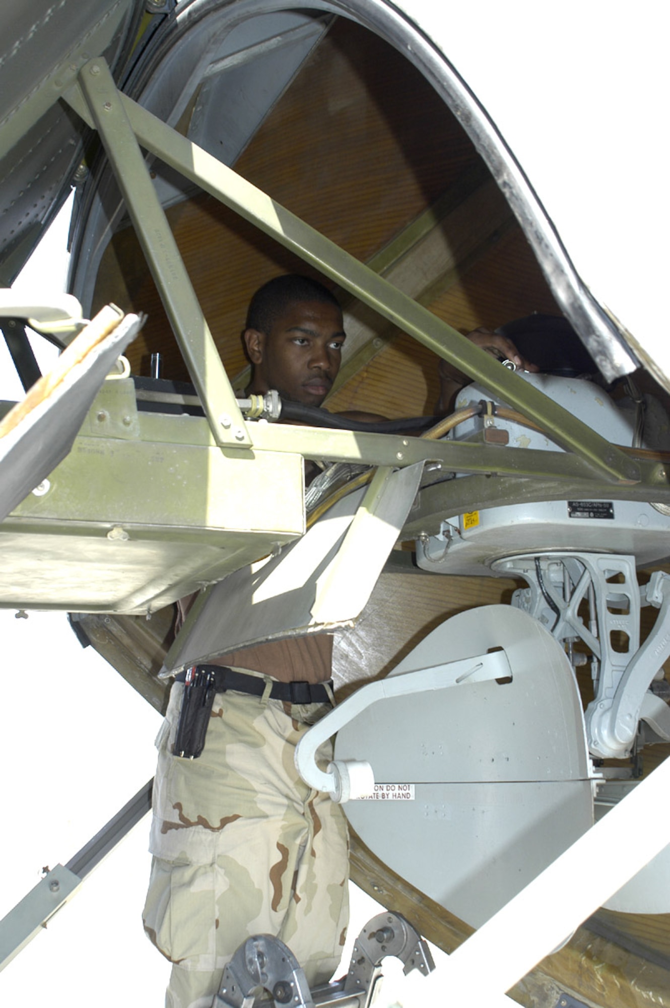 SOUTHWEST ASIA -- Senior Airman Anthony Martin inspects a C-130 Hercules radar gyro system to ensure it is working properly. The Airman, with the 386th Expeditionary Aircraft Maintenance Squadron here, is deployed from Little Rock Air Force Base, Ark., to help maintains aircraft conducting operations in Iraq, Afghanistan and the Horn of Africa. (U.S. Air Force photo by Staff Sgt. Scott Campbell)
