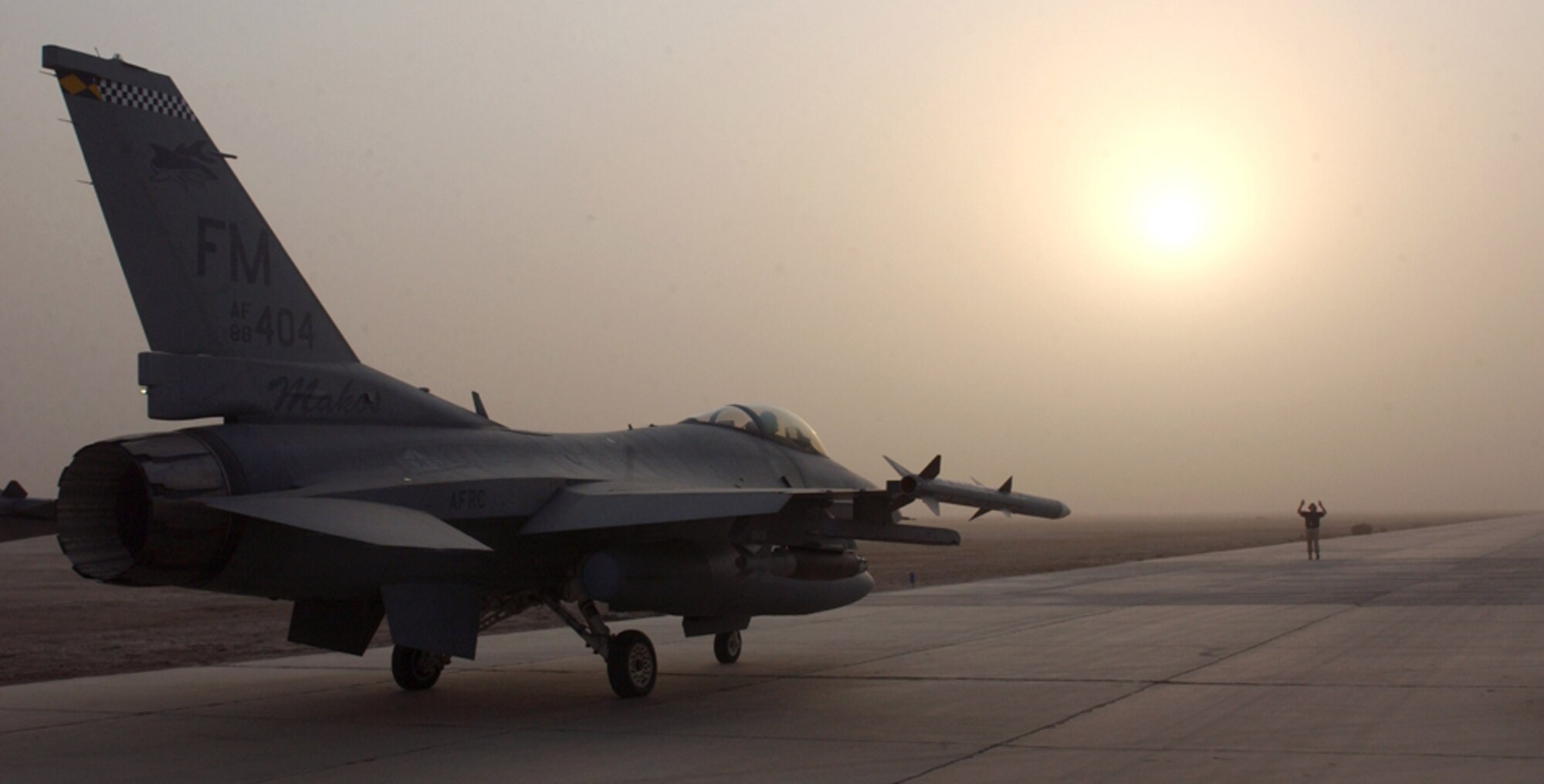 ALI BASE, Iraq -- After spending the night here because of a weather diversion, an F-16 Fighting Falcon lines up for takeoff Oct. 18. The aircraft is of the 332nd Expeditionary Fighter Squadron, Balad Air Base, Iraq. The fighters deployed from the 482nd Fighter Wing at Homestead Air Reserve Base, Fla. They provide air support to Operation Iraqi Freedom coalition ground forces. (U.S. Air Force photo by Tech. Sgt. Paul Dean) 