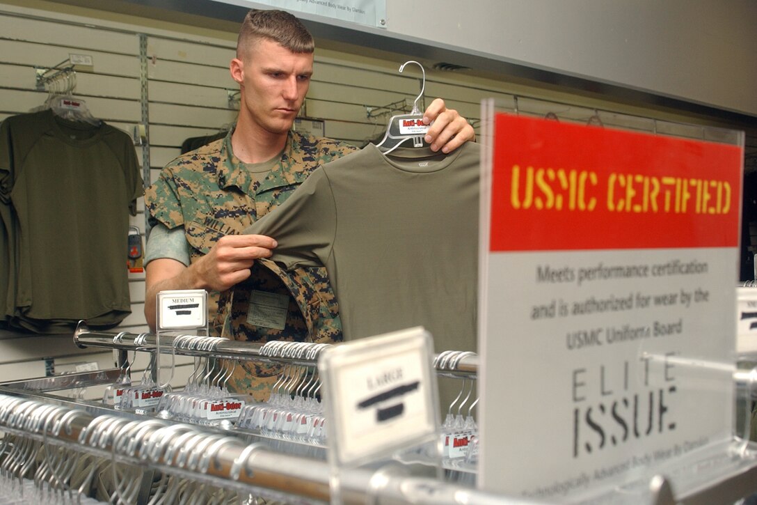 MARINE CORPS BASE CAMP LEJEUNE, N.C. - Lance Cpl. Aaron T. Williams, a rifleman with Company L, 3rd Battalion, 8th Marine Regiment, 2nd Marine Division, looks through a rack of Elite Issue shirts for the first time. Developed by Danskin, Inc., Elite Issue shirts are USMC certified with anti-microbial, anti-odor and anti-mositure technology. Photo by Lance Cpl. Adam Johnston