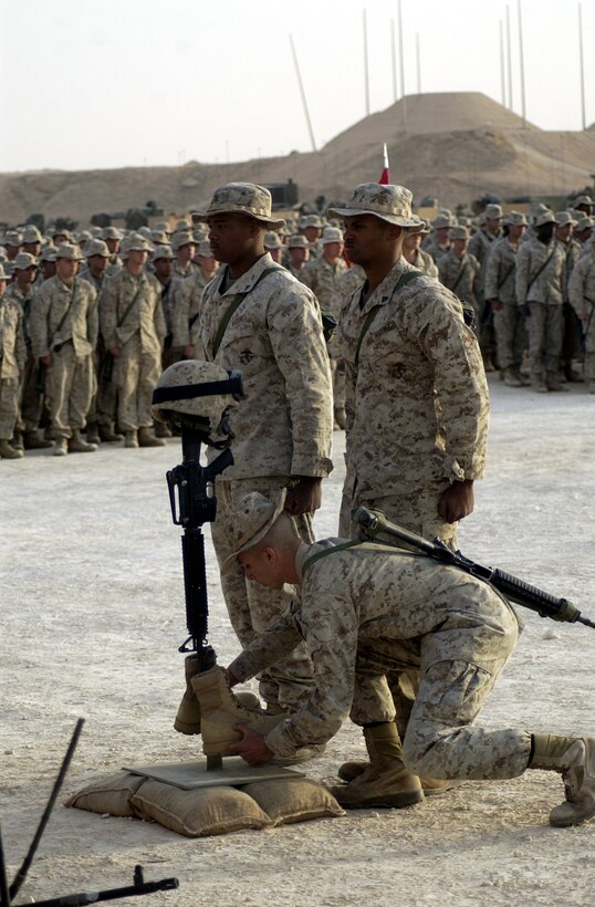 CAMP TAQADDUM, Iraq (Oct. 20, 2005) ? Lance Cpl. Bradford E. Laws ?rocks out? on his banjo here Oct. 20. This Marine?s six years of playing the banjo in the United States was not put on hold for his deployment here. Laws is a nuclear, biological and chemical specialist with Headquarters Company, Headquarters and Service Battalion and 2nd Force Service Support Group (Forward).
