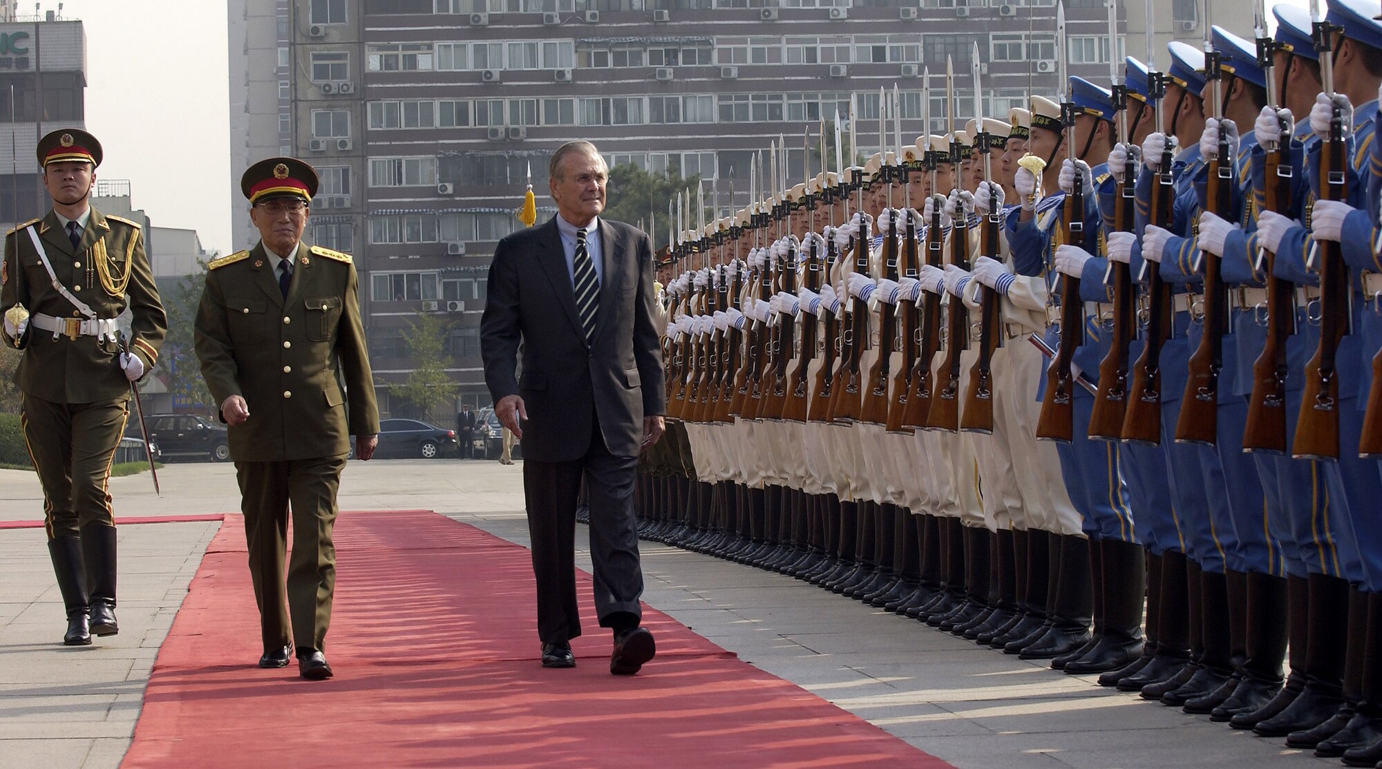 BEIJING -- Secretary of Defense Donald H. Rumsfeld and Gen. Cao Gangchuan, vice chairman of the central military committee, and China's minister of defense, do a pass and review of military members at the Bayi Building here. Secretary Rumsfeld traveled to China Oct. 19 to meet with military and civilian leaders and discuss U.S.-China defense relationships and cooperation in areas of common interest. (U.S. Air Force photo by Master Sgt. James M. Bowman)