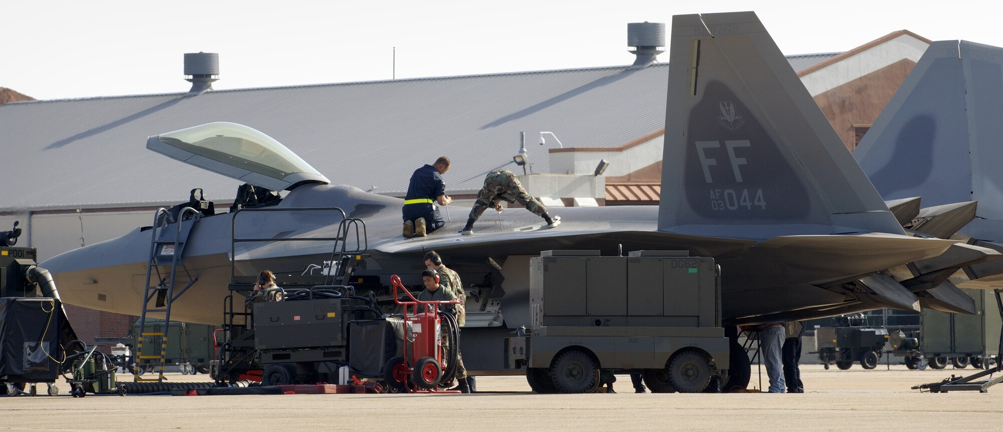 LANGLEY AIR FORCE BASE, Va. -- Airmen with the 27th Aircraft Maintenance Unit make final inspection checks on an F/A-22 Raptor before launching it. The Raptor was bound for Hill Air Force Base, Utah. The unit deployed there Oct. 15 with a twofold goal: complete a deployment and to generate a combat-effective sortie rate away while deployed. (U.S. Air Force photo by Staff Sgt. Eric T. Sheler)