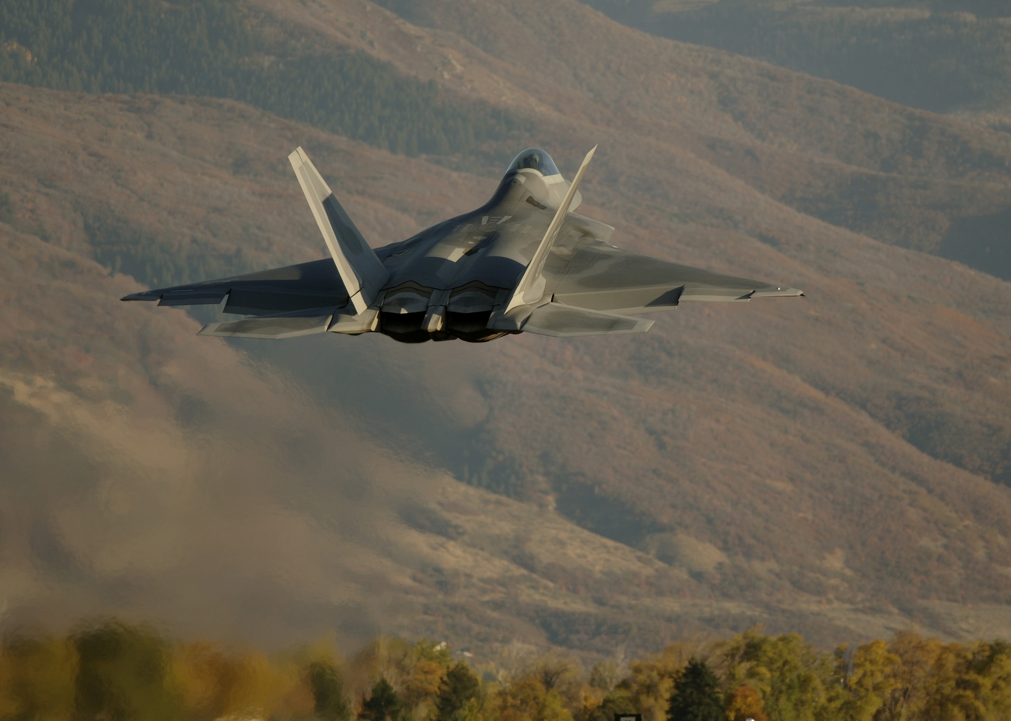 HILL AIR FORCE BASE, Utah -- Maj. Michael Shower lifts his F/A-22 Raptor from here for a late Combat Hammer mission Oct. 17. The major flies with the 27th Fighter Squadron, the Air Force's first operational F/A-22 squadron, at Langley Air Force Base, Va. The deployment has a twofold goal: complete a deployment and to generate a combat-effective sortie rate away while deployed. (U.S. Air Force photo by Tech. Sgt. Ben Bloker) 