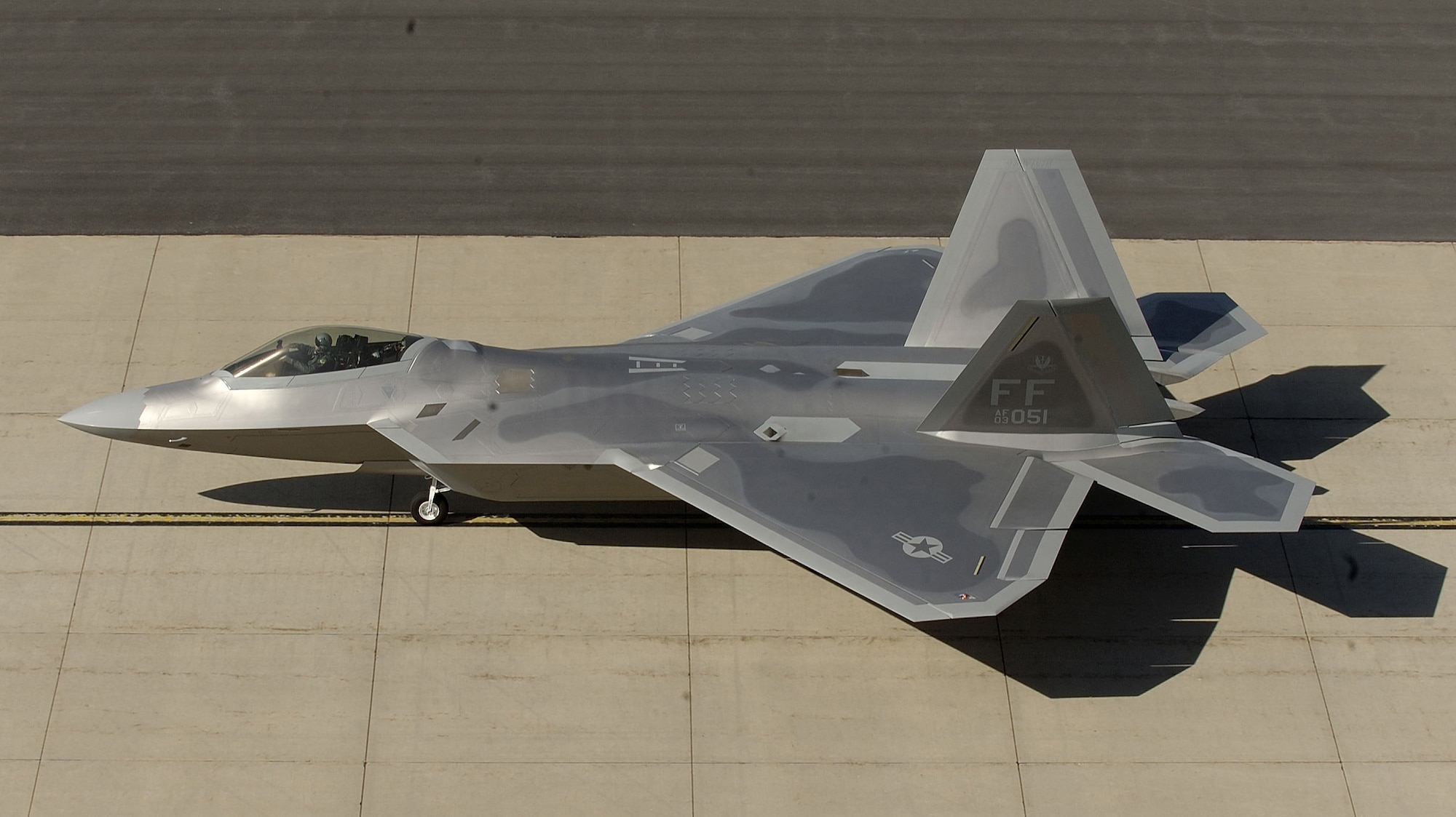 HILL AIR FORCE BASE, Utah -- An F/A-22 Raptor taxis after landing here. The jet, from the 27th Fighter Squadron at Langley Air Force Base, Va., deployed here Oct. 15 for the next-generation fighter's first deployment for live weapons bomb training exercise. (U.S. Air Force photo by Staff Sgt. Samuel Rogers)