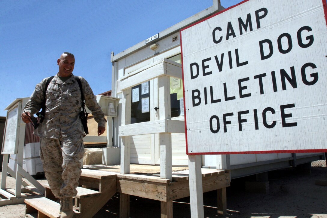 AL TAQADDUM, Iraq (Aug. 23, 2007) ? Master Gunnery Sgt. James Hunter claims a room at a billeting office here for a two-day stay before he returned to Al Asad. During his visit, Hunter spent time with his oldest son, Lance Cpl. Mitchell Hunter, who arrived to Taqaddum approximately 20 minutes after his father. While at Al Asad, Master Gunnery Sgt. Hunter serves as an aircraft maintenance chief with 2nd Marine Aircraft Wing (Forward). Lance Cpl. Hunter will be serving here as a landing support specialist with Transportation Support Company, 2nd Supply Battalion, 2nd Marine Logistics Group (Forward).