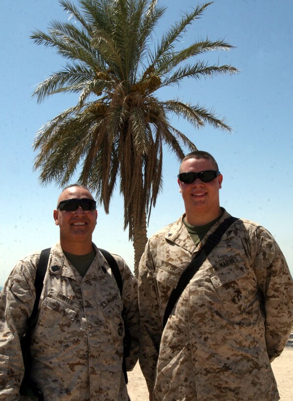 AL TAQADDUM, Iraq (Aug. 23, 2007) ? Master Gunnery Sgt. James Hunter and Lance Cpl. Mitchell Hunter enjoy a day together at Al Taqaddum. James is Mitchell?s father and he arrived here from his station at Al Asad to spend time with his son. At Al Asad, James Hunter serves as an aircraft maintenance chief with 2nd Marine Aircraft Wing (Forward).Mitchell Hunter will be serving here as a landing support specialist with Transportation Support Company, 2nd Supply Battalion, 2nd Marine Logistics Group (Forward).