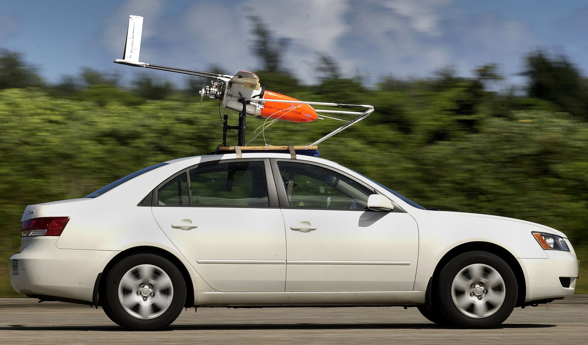 ANDERSEN AIR FORCE BASE, Guam -- A Weatherscout weather unmanned aerial vehicle takes off on a test flight Oct. 18. Pilots launch the 30-pound aircraft from cars at 40 mph. (U.S. Air Force photo by Michael S. Dorus)