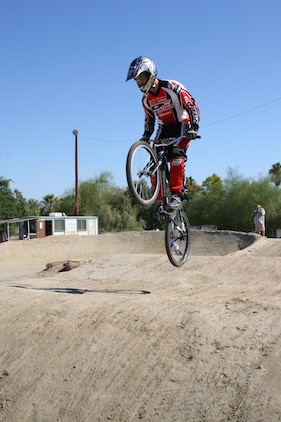 Sergeant Brian Randolph, electronics instructor at the Marine Corps Communication-Electronics School here, BMX races over the tracks in Palm Springs Oct. 28 to 30. Marine Corps Community Services sponsored Randolph with transportation and entry fee in the American Bicycle Association Fall Nationals where he won first place in his age category in day one and two of the competition.