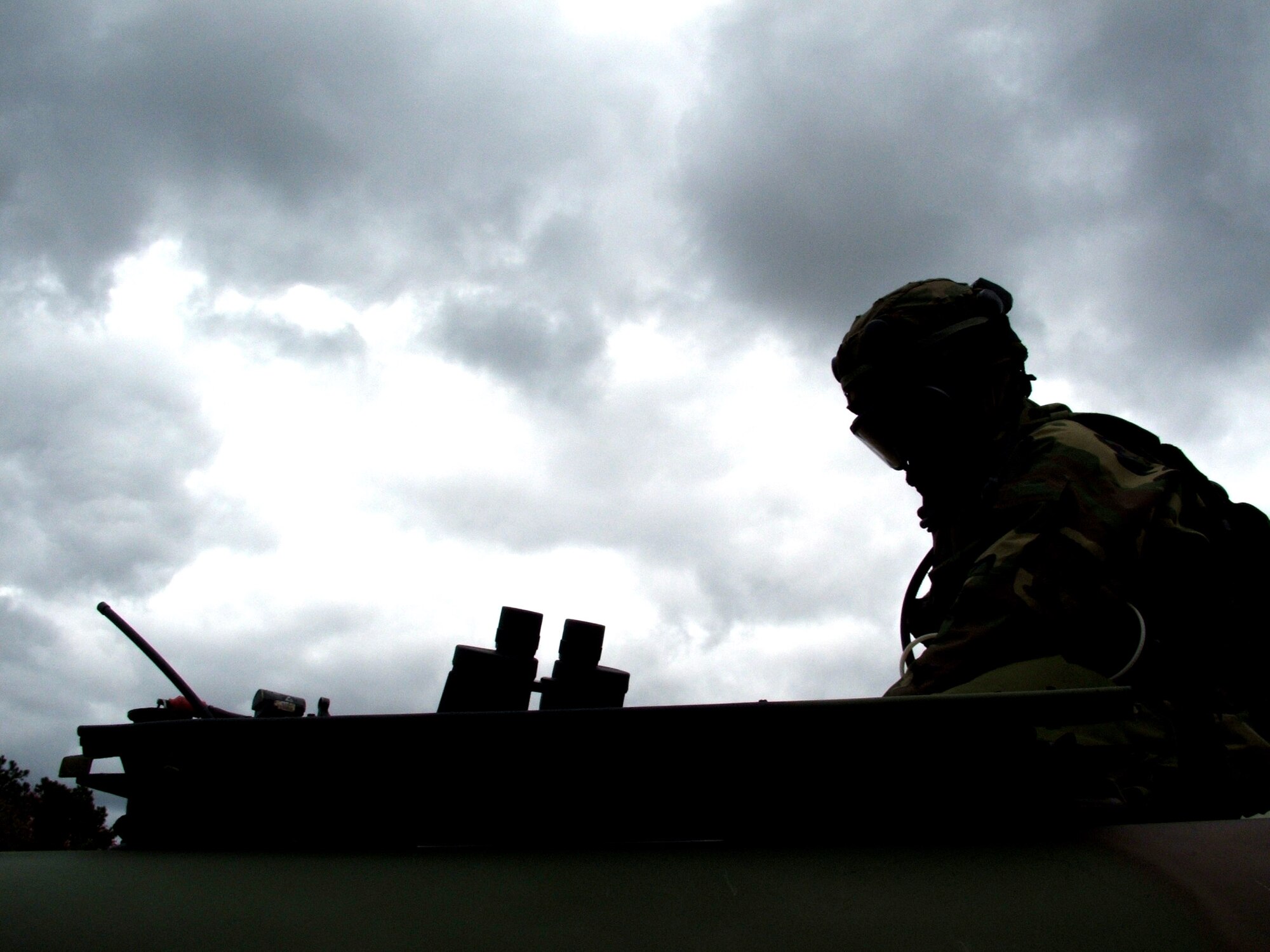 NAVAL AIR ENGINEERING STATION LAKEHURST, N.J. (AFPN) -- Senior Airman Charles Nelson stands guard in the turret of his Humvee during exercise Eagle Flag 06-1 here. The Airman was on guard duty Oct. 23. He deployed here from the 613th Security Forces Squadron at Anderson Air Force Base, Guam, is here to support the 613th Contingency Response Group.  (U.S. Air Force photo by Tech. Sgt. Scott T. Sturkol)
