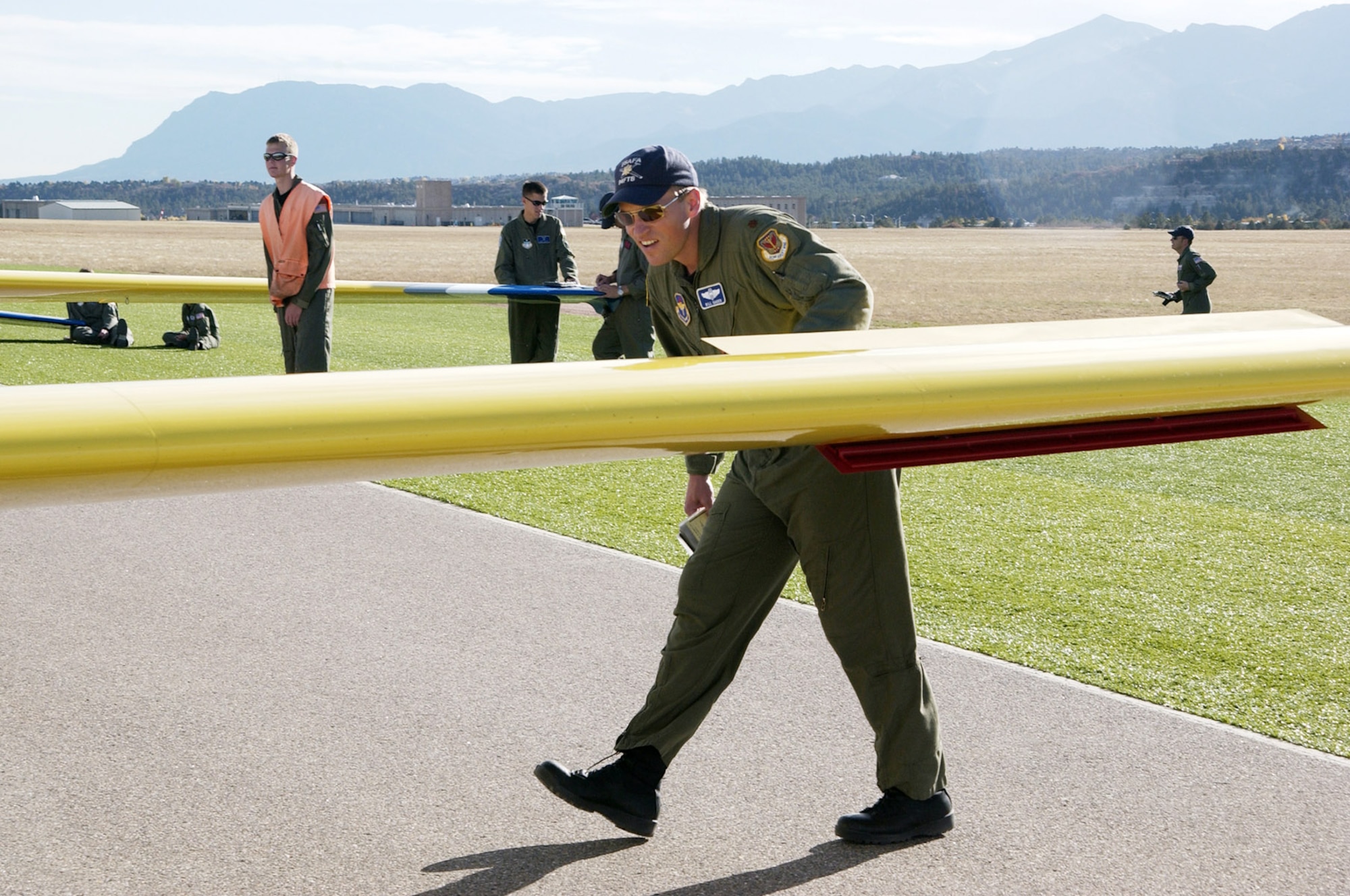 Major Bill Gagen performs a walk-around check of a glider before takeoff recently at the U.S. Air Force Academy in Colorado Springs, Colo.  Major Gagen and about 30 other Reservists formed for the squadron recently giving Reservists a more prominent role in training cadets at the school. (Photo by Tech. Sgt. Jason Tudor)
