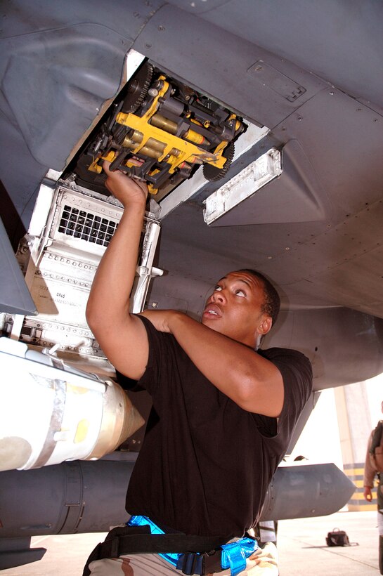 FORWARD DEPLOYED LOCATION (AFPN) -- Crew chief Staff Sgt. Aaron Blackwell checks the 20mm Gatling gun on an F-15E Strike Eagle here. The fighter is from the 492nd Expeditionary Fighter Squadron here. (U.S. Air Force photo by Master Sgt. Peter Borys) 